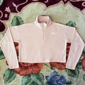 the north face pink cropped quarter-zip fleece sweater.